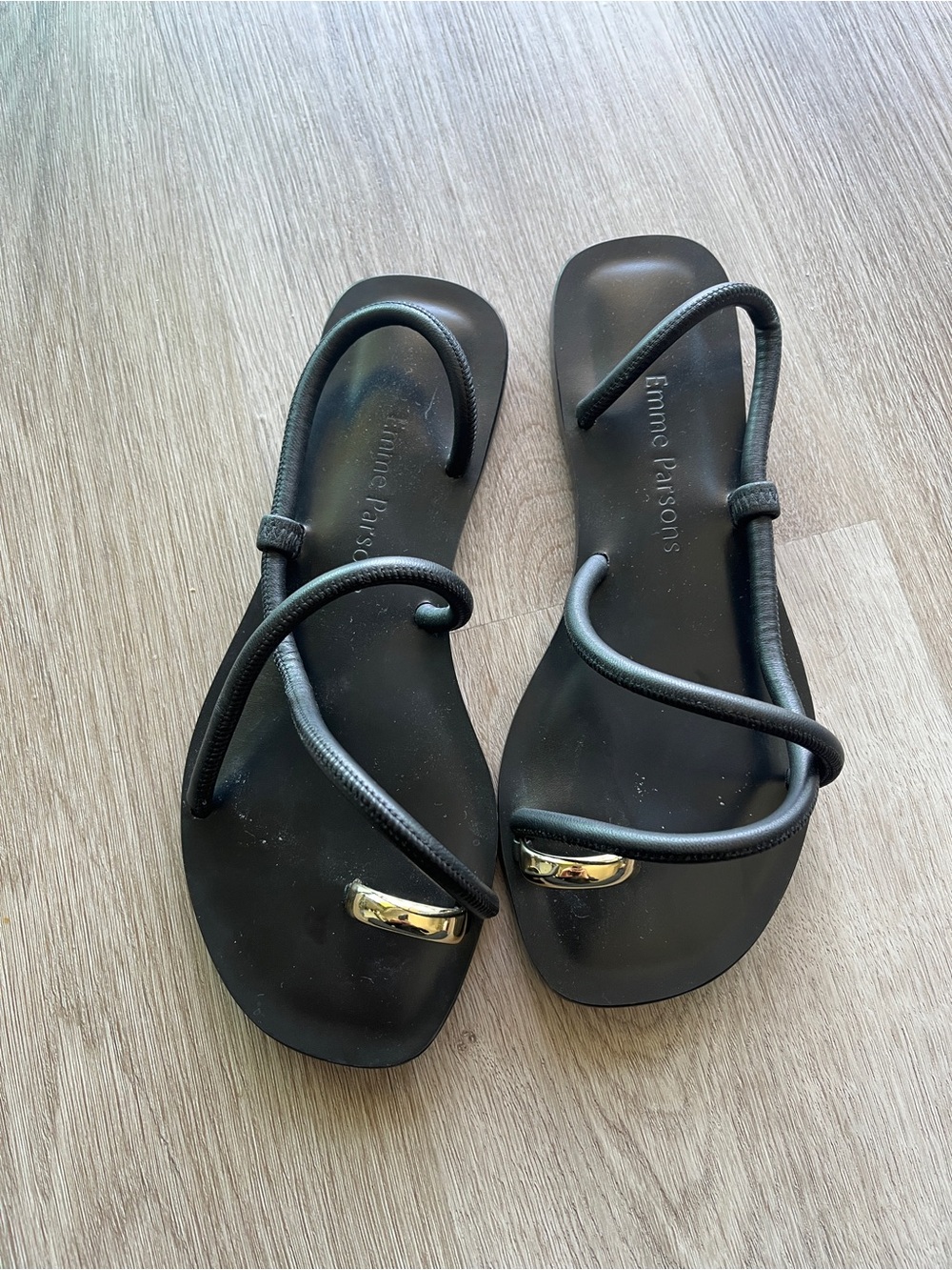 Emme Parsons “Laurie Sandals” Black Ankle-Strap Sandals with Gold Accent